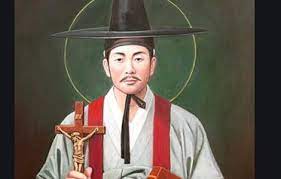 Picture of Saint Kim Dae-Gŏn holding a crucifix.